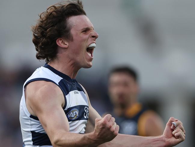 GEELONG, AUSTRALIA - MAY 06: Max Holmes of the Cats celebrates after scoring a goal during the round eight AFL match between Geelong Cats and Adelaide Crows at GMHBA Stadium, on May 06, 2023, in Geelong, Australia. (Photo by Robert Cianflone/Getty Images)