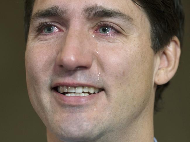 Canadian Prime Minister Justin Trudeau speaks about Tragically Hip singer Gord Downie before caucus on Parliament Hill, in Ottawa on Wednesday, Oct. 18, 2017.  Downie, the poetic lead singer of the Tragically Hip whose determined fight with brain cancer inspired a nation, has died. He was 53.  Downie died Tuesday, Oct. 17, 2017,  "with his beloved children and family close by," the band said in a statement on its website Wednesday morning.    (Adrian Wyld/The Canadian Press via AP)