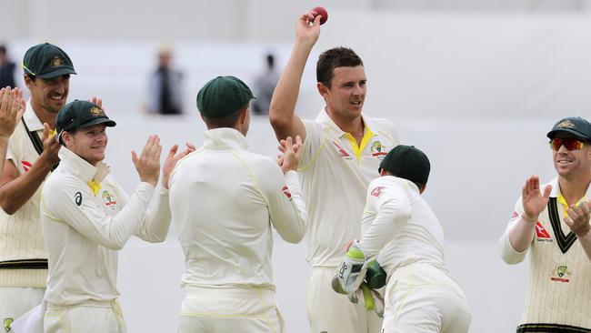 Australian paceman Josh Hazlewood celebrates taking his fifth wicket against England on Monday.