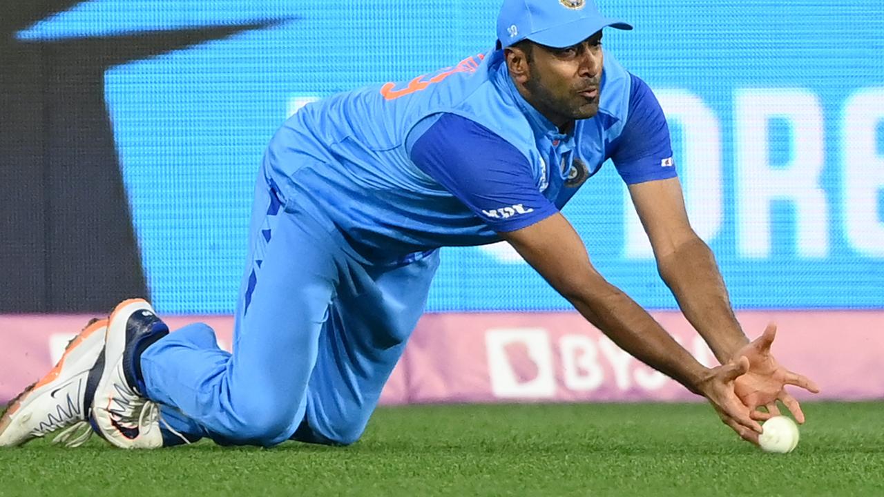 MELBOURNE, AUSTRALIA - OCTOBER 23: Ravichandran Ashwin of India dives to attempt a catch to dismiss Shan Masood of Pakistan bats during the ICC Men's T20 World Cup match between India and Pakistan at Melbourne Cricket Ground on October 23, 2022 in Melbourne, Australia. (Photo by Quinn Rooney/Getty Images)