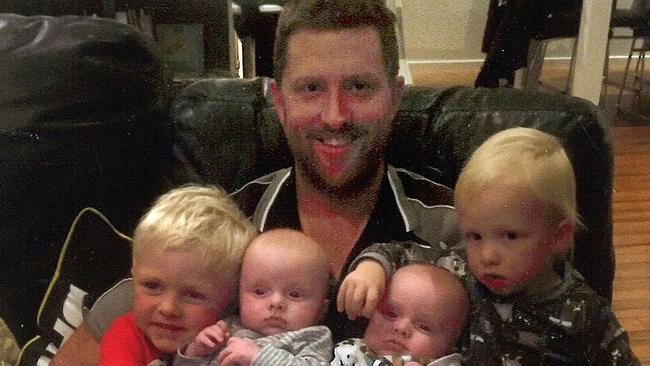 Jackson, 5, Austin, 4, and twins Hughey and Cooper, 2, with dad Greg ‘Robbo’ Roberts, 37, who was killed in a workplace accident.