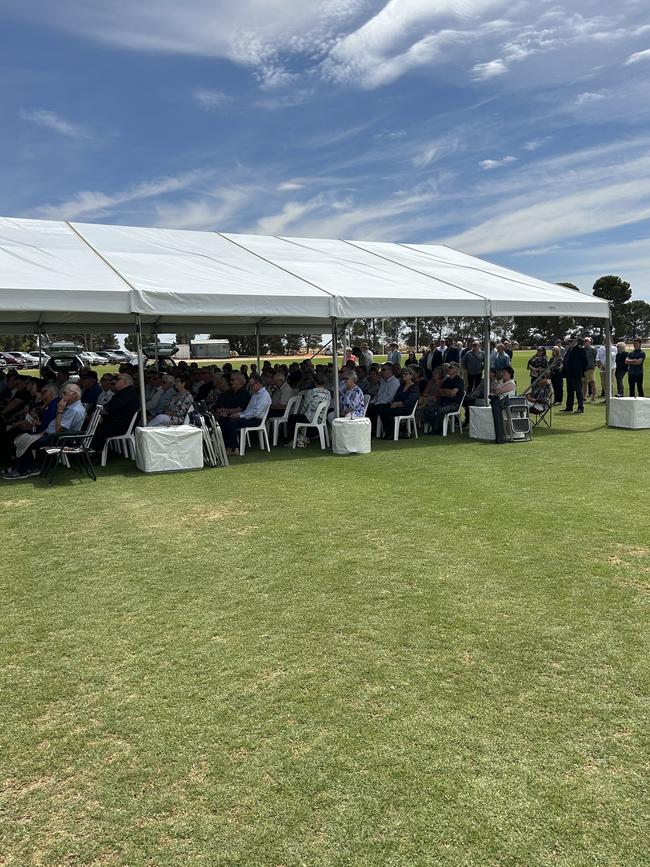 Mourners at the Clark family funeral at the Blyth Snowtown Football Club.