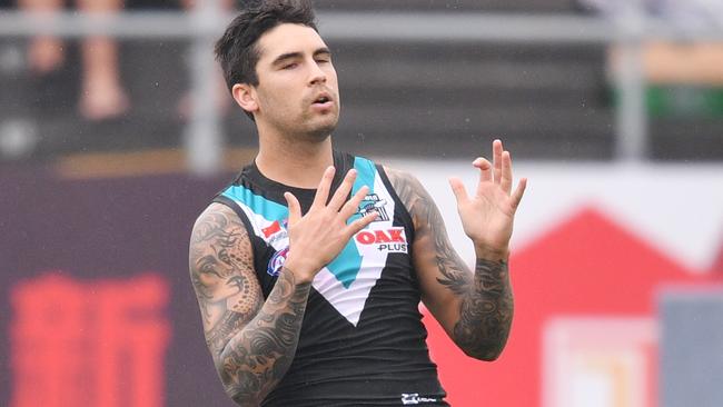 Chad Wingard reacts after missing a goal in China. Picture: AAP Images