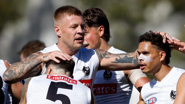 MELBOURNE, AUSTRALIA - FEBRUARY 14: Bobby Hill of the Magpies celebrates a goal with teammates during a Collingwood Magpies training session at AIA Centre on February 14, 2024 in Melbourne, Australia. (Photo by Dylan Burns/AFL Photos via Getty Images)