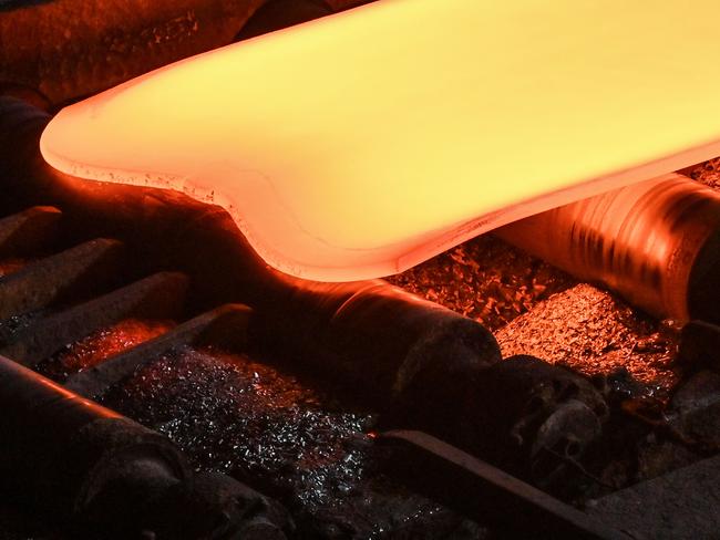 (FILES) This general view shows steel moving along rollers at the hot rolling mill (rough rolling) during a media tour by Japanese company Nippon Steel at their East Nippon Works Kashima Area facility in Kashima, Ibaraki prefecture, north of Tokyo on December 6, 2024. US Secretary of State Antony Blinken insisted during a visit to Tokyo on January 7, 2025 that ties with Japan were stronger than ever, days after President Joe Biden blocked Nippon Steel's takeover of US Steel. This a day after Nippon Steel and US Steel filed suit over Biden's decision to block the Japanese giant's proposed acquisition of its American rival. (Photo by Richard A. Brooks / AFP)