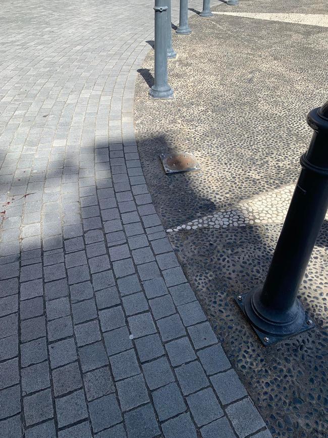 The spot where the unsecured bollard fell.