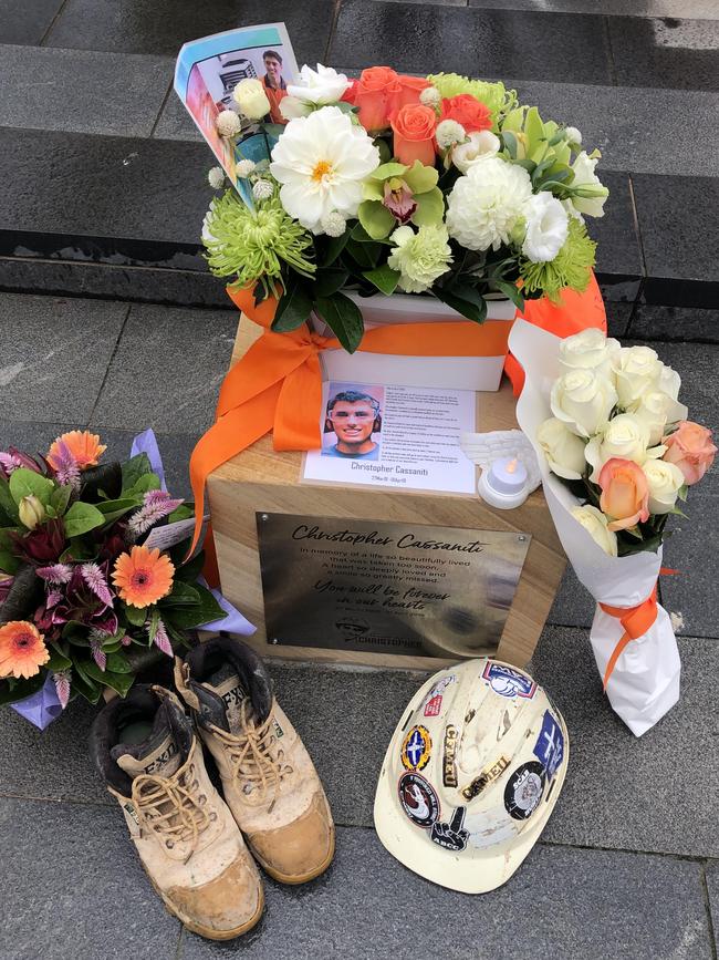 From colourful flowers and dusted work boots to hand-written cards to their beloved son, it was an emotional and intimate memorial for the family. Picture: supplied