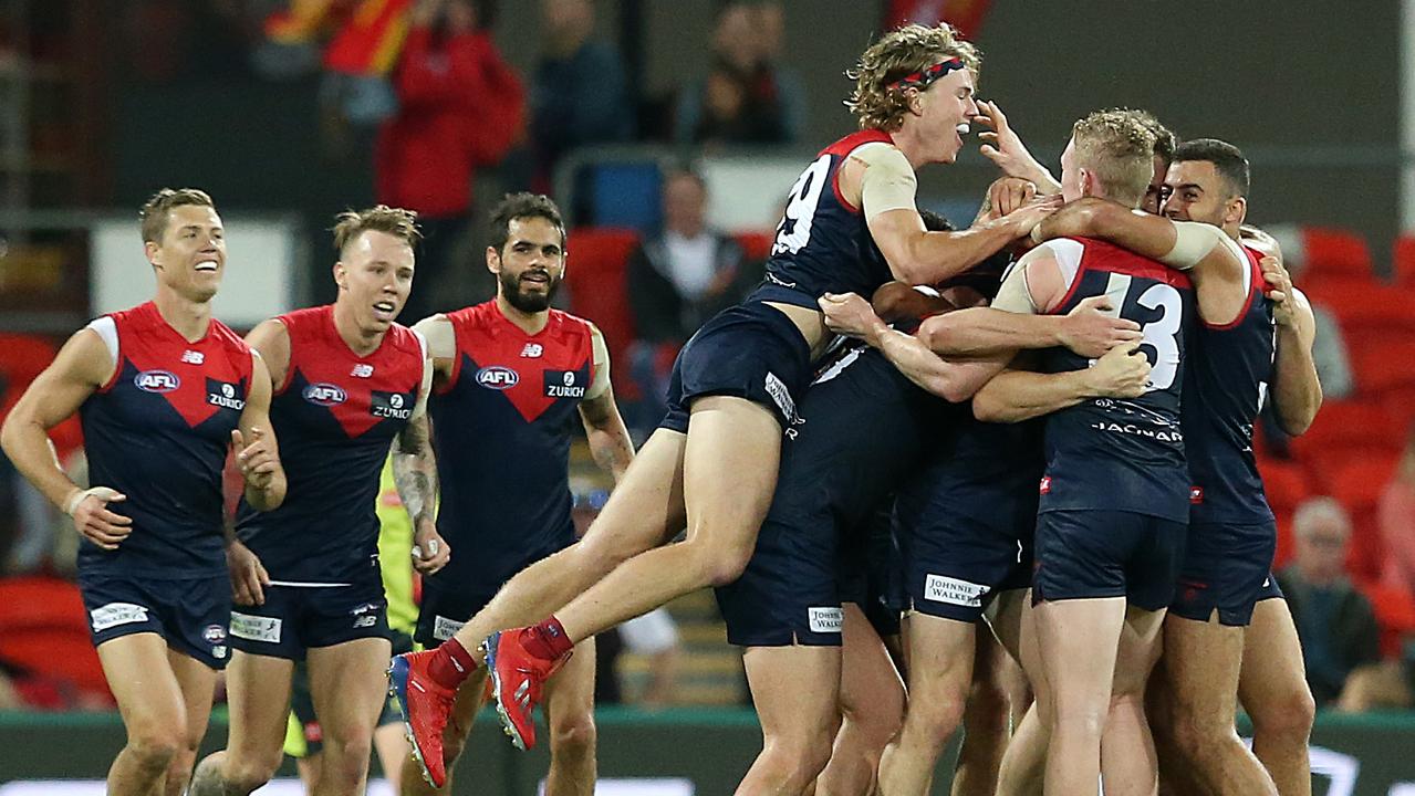 Melbourne celebrate a win agains the Suns in the 2019 season.