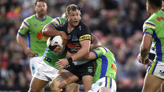 PENRITH, AUSTRALIA - AUGUST 05: Trent Merrin of the Panthers is tackled during the round 21 NRL match between the Penrith Panthers and the Canberra Raiders at Panthers Stadium on August 5, 2018 in Penrith, Australia. (Photo by Ryan Pierse/Getty Images)