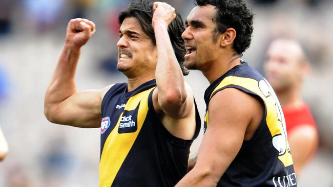 Jordan McMahon celebrates his matchwinning goal against Melbourne with Richard Tambling.