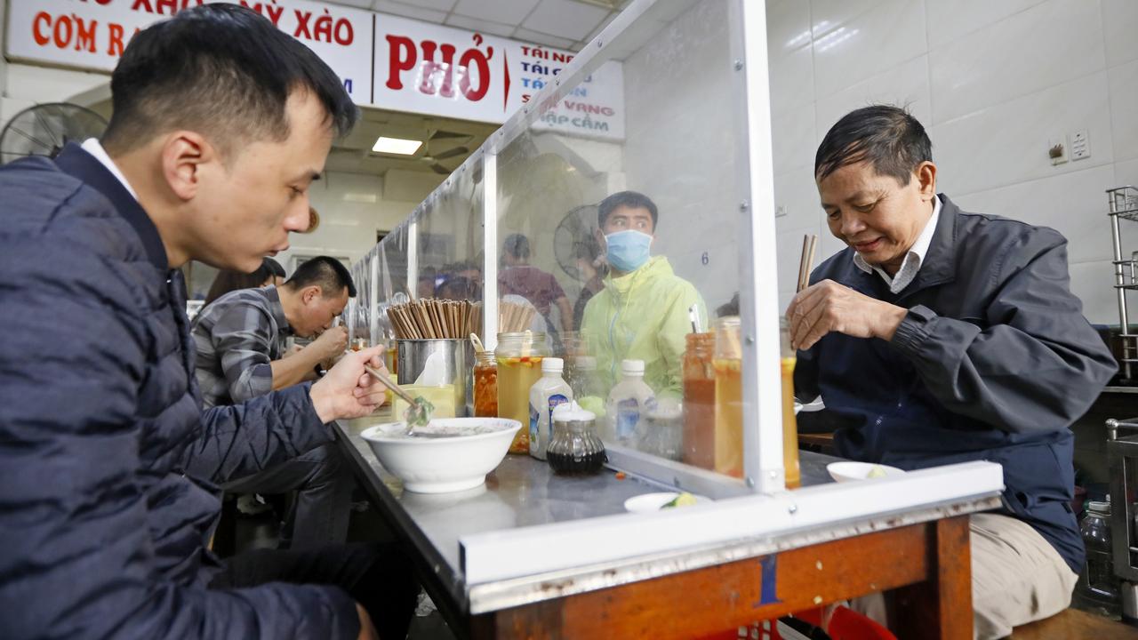 People eat pho in Vietnam on April 27, following the easing of lockdowns in the country. Picture: Luong Thai Linh