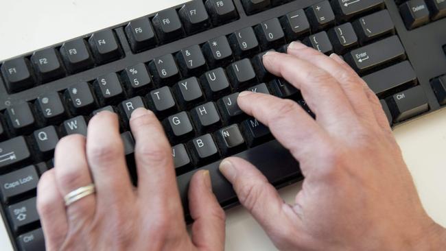 (FILES) In this file photo taken on November 21, 2016 a man types on a computer keyboard in this photo illustration taken in Washington, DC. - An elite group of North Korean hackers has been identified as the source of a wave of cyberattacks on global banks that has netted "hundreds of millions" of dollars, security researchers said on October 3, 2018. A report by the cybersecurity firm FireEye said the newly identified group dubbed APT38 is distinct from but linked to other North Korean hacking operations, and has the mission of raising funds for the isolated Pyongyang regime. (Photo by SAUL LOEB / AFP)