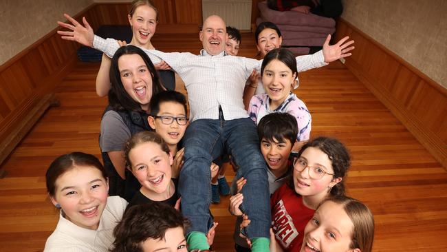 NAPLAN results over five years and the top performing schools. Fitzroy Community School Principal Timothy Berryman getting carried away with Year 6 students over their top NAPLAN performance.                     Picture: David Caird