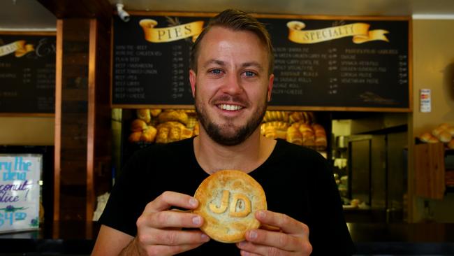 Main Beach Bakery owner Nathan Swadling with a Jack Daniels Pie. Photo: David Clark