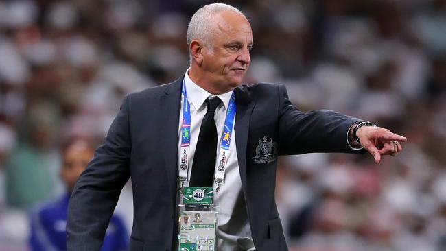 Graham Arnold of Australia gives his team instructions during the Asian Cup quarter-final.