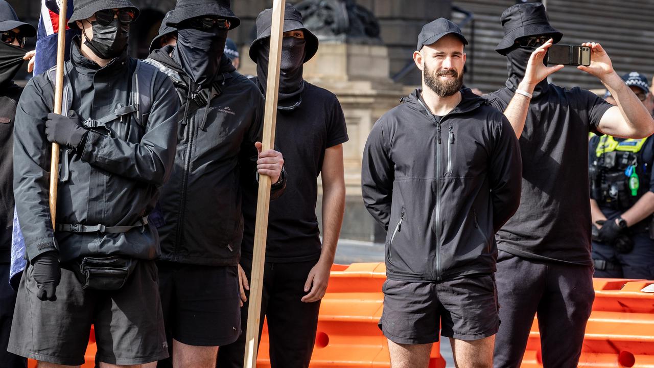 National Socialist Network leader Thomas Sewell (right) stands by his group of neo-Nazis, who have been spreading their message in Geelong. Picture: Jake Nowakowski