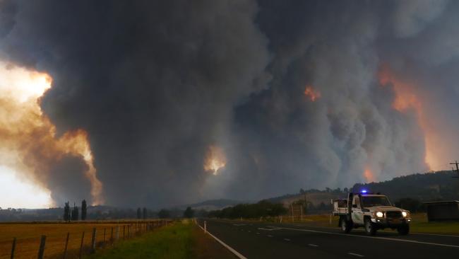 An emergency services vehicle outside Bruthen on Monday as fires approached the East Gippsland town. Picture: David Crosling