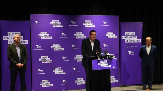 Victoria's Chief Health Officer Dr Brett Sutton, Victorian Premier Daniel Andrews and Education Minister James Merlino at a press conference announcing the staggered return to on-site learning at schools from May 26. Picture: James Ross