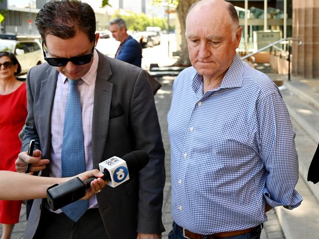 Former Renewal SA chief executive John Hanlon refused to answer journalists’ questions outside the Adelaide Magistrates Court. Picture: AAP Image/David Mariuz