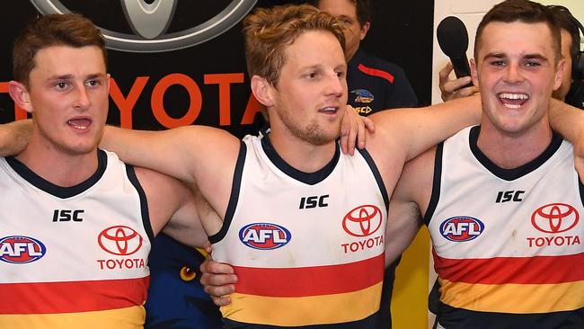 MELBOURNE, AUSTRALIA - APRIL 27:  Matt Crouch, Rory Sloane, Brad Crouch and Taylor Walker of the Crows sing the song in the rooms after winning the round 6 AFL match between St Kilda and Adelaide at Marvel Stadium on April 27, 2019 in Melbourne, Australia. (Photo by Quinn Rooney/Getty Images)