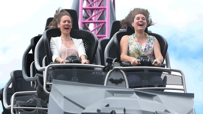 Journalists Kate Donadini and Amanda Robbemond (left) try out the hypercoaster as its launch yesterday. Picture: Glenn Hampson.