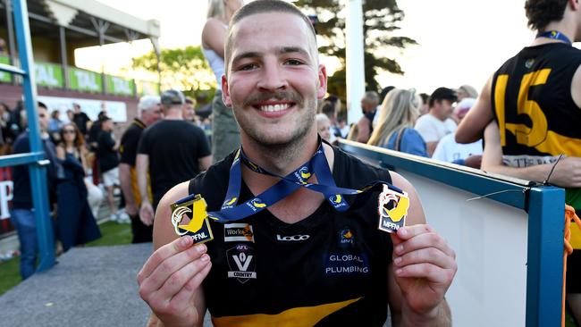 Billy Geurts with his premiership and best on ground medals. (Photo by Josh Chadwick)