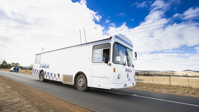 A Tasmania Police bus near the area where Jarrod Turner’s body was found. Picture: RICHARD JUPE