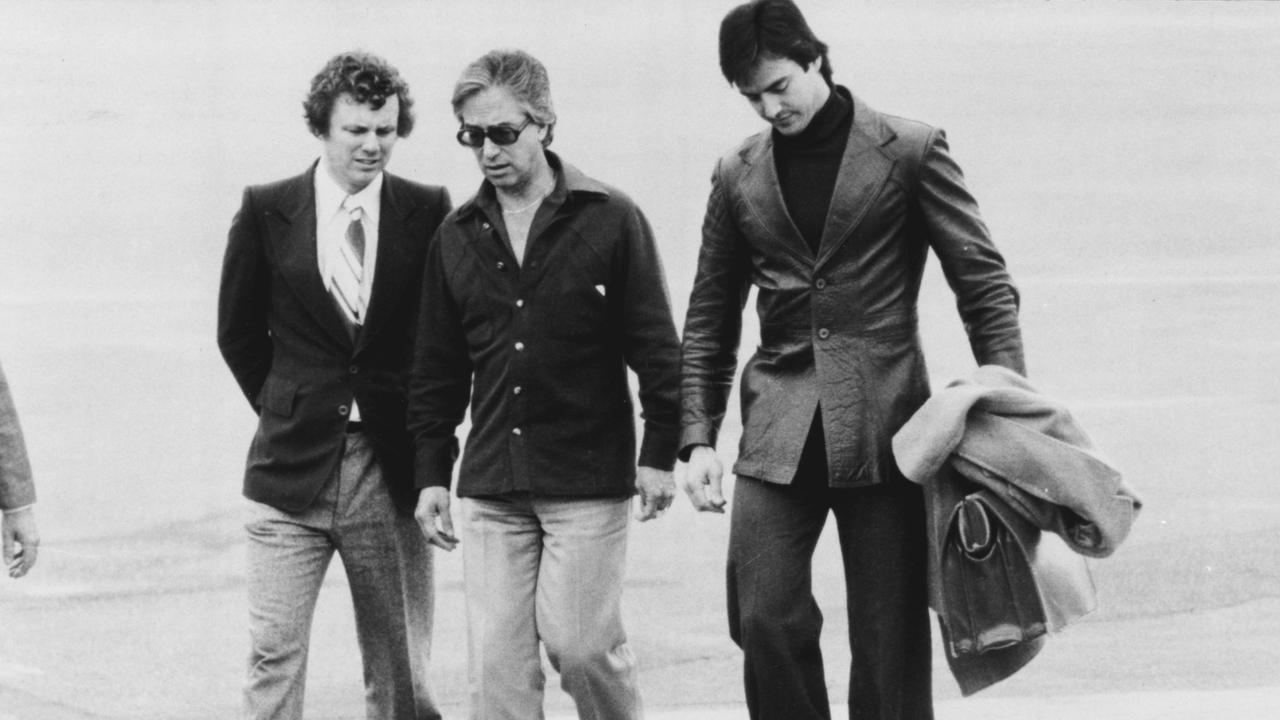 Don Dunstan arriving at Adelaide airport with Mike Rann (left) and Steven Wright (right). Picture: Steven Cheng