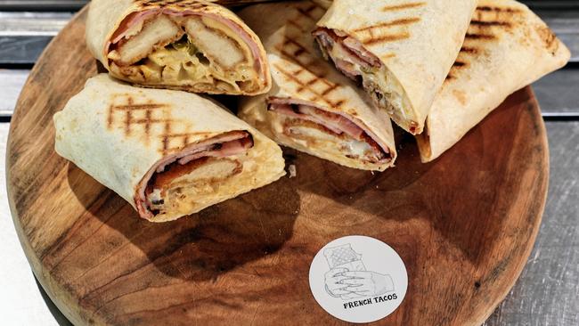 Cairns culinary types are being introduced to a new fusion takeaway option – French Tacos. The owners of NOA cafe in Edge Hill and Candy Cafe in Grafton Street have begun cooking up burrito style wraps with French ingredients. Picture: Brendan Radke.