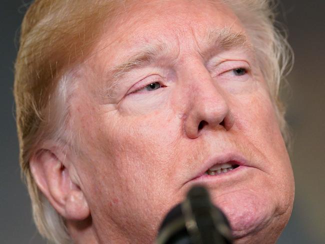 US President Donald Trump speaks before signing trade sanctions against China on March 22, 2018, in the Diplomatic Reception Room of the White House in Washington, DC, on March 22, 2018. / AFP PHOTO / Mandel NGAN