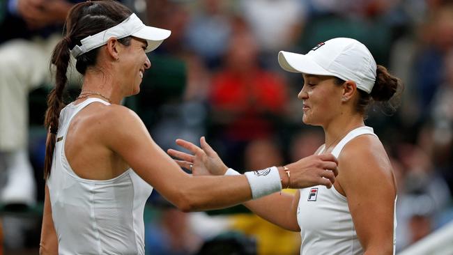 Ajla Tomljanovic and Ash Barty embrace after the match. Picture: AFP Photos