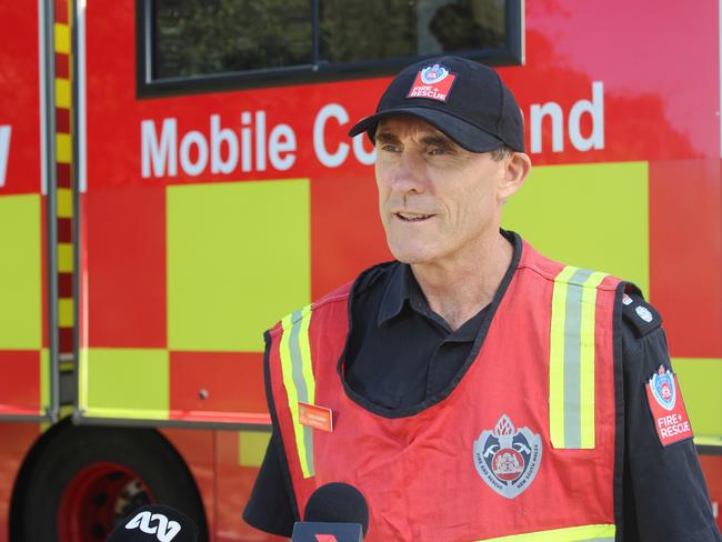 Fire and Rescue NSW Incident Commander Superintendent Greg Rankin. Crews and NSW Fire and Rescue have set up camp in Coramba, bringing with them vehicles and equipment to deal with the derailed train at nearby Nana Glen. The rain and subsequent flooding has so far meant they have been unable to access the site via road.  Train derailment.  Photo: Tim Jarrett