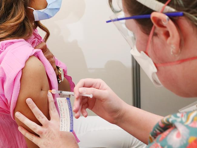 MELBOURNE, AUSTRALIA - NewsWire Photos, DECEMBER 23, 2021. A woman ( I was asked not to use names) receives her booster covid shot at the Sandown Racecourse COVID Vaccination centre . Picture: NCA NewsWire / David Crosling