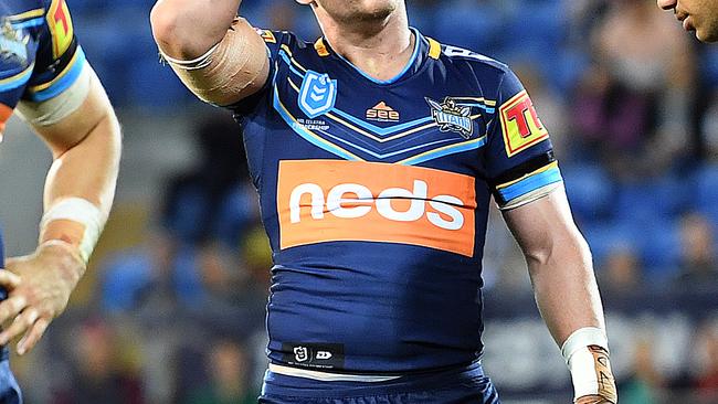 A J Brimson of the Titans (centre) looks on following a North Queensland try during the Round 12 NRL match between the Gold Coast Titans and the North Queensland Cowboys at CBus Super Stadium on the Gold Coast, Sunday, June 2, 2019. (AAP Image/Dave Hunt) NO ARCHIVING, EDITORIAL USE ONLY