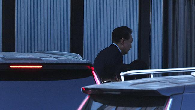 Impeached South Korean President Yoon Suk Yeol arrives at the Corruption Investigation Office for High-ranking Officials after his arrest. Picture: Getty Images.