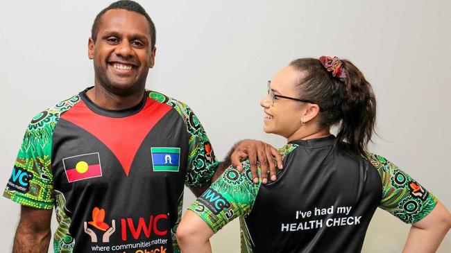 CHARITY'S COSTLY SHIRTS: IWC indigenous health worker, Kane Chapman and medical centre receptionist, Sharnese Mills wearing shirts that are distributed to patients. Picture: Simon Young