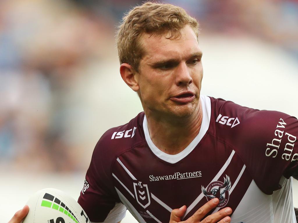 GOLD COAST, AUSTRALIA - JUNE 29: Tom Trbojevic of the Sea Eagles is tackled during the round 15 NRL match between the Gold Coast Titans and the Manly Sea Eagles at Cbus Super Stadium on June 29, 2019 in Gold Coast, Australia. (Photo by Chris Hyde/Getty Images)