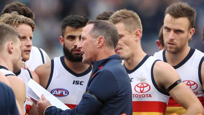 Adelaide coach Don Pyke talks with his players during the Round 19 AFL match between the Carlton Blues and the Adelaide Crows at the MCG in Melbourne (AAP Image/David Crosling) NO ARCHIVING, EDITORIAL USE ONLY