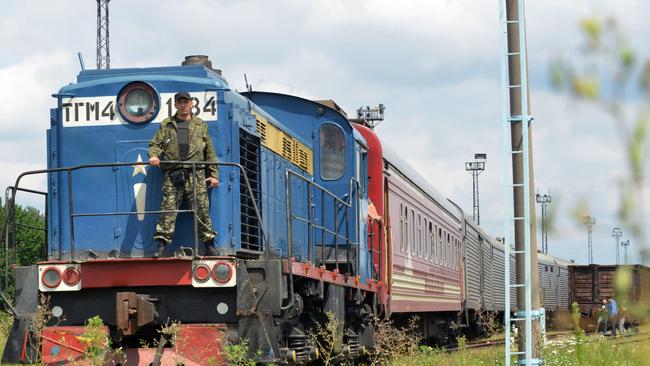 Bodies arrive ... the train carrying the 280 bodies recovered from the downed Malaysian flight MH17 arrives at the Malyshev Plant, in the government-held Ukrainian city of Kharkiv. Picture: Sergey Bobok