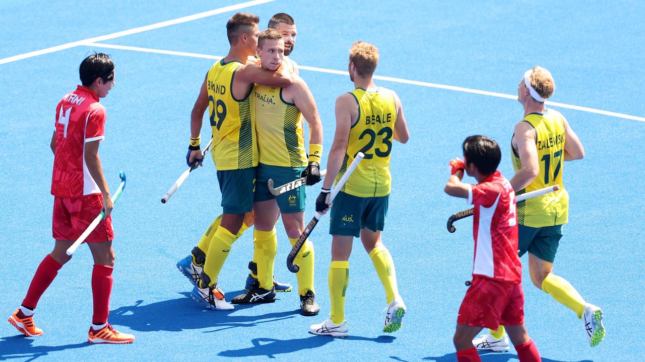 Tim Brand of Australia celebrates with teammates after scoring against Japan. Picture: Getty Images