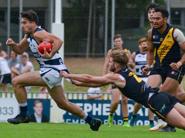 SANFL: Glenelg v South Adelaide at Glenelg Oval, Saturday, April 13, 2019. Jonty Scharenberg tries to stop South's Nic Schwarz. (AAP Image/Brenton Edwards),