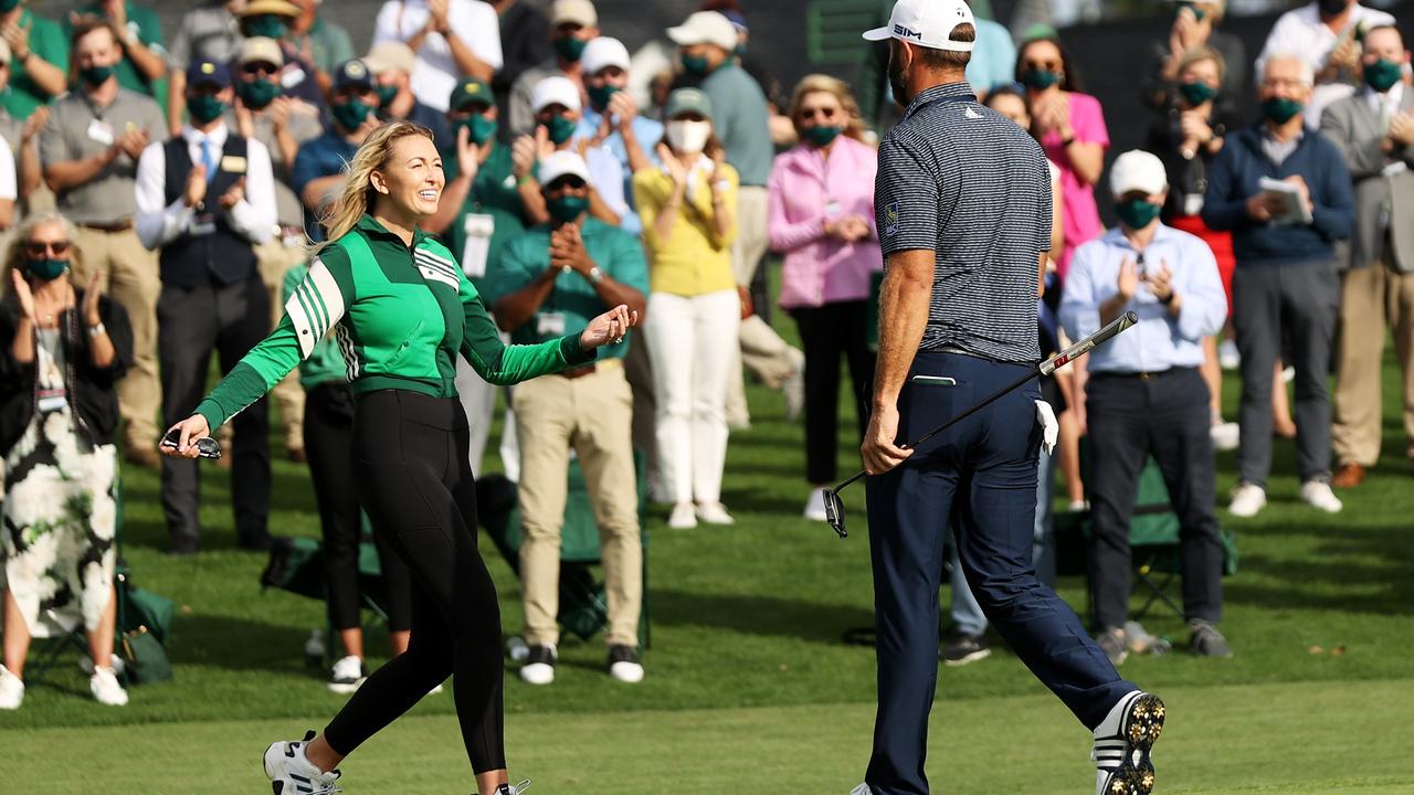 Paulina Gretzky runs on to the green to greet Dustin Johnson. (Photo by Rob Carr/Getty Images)