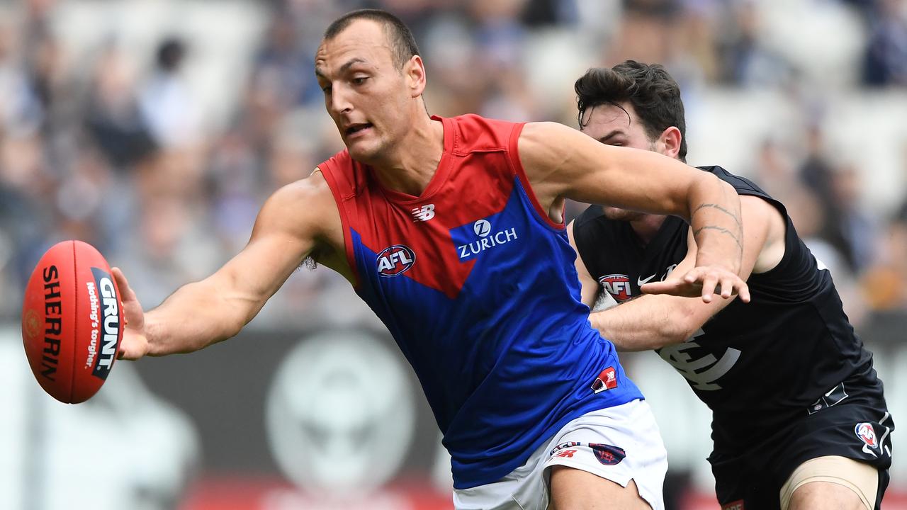 Braydon Preuss of the Demons (left) and Mitch McGovern of the Blues contest during the Round 16 AFL match between the Carlton Blues and the Melbourne Demons at the MCG in Melbourne, Sunday, July 7, 2019. (AAP Image/Julian Smith) NO ARCHIVING, EDITORIAL USE ONLY