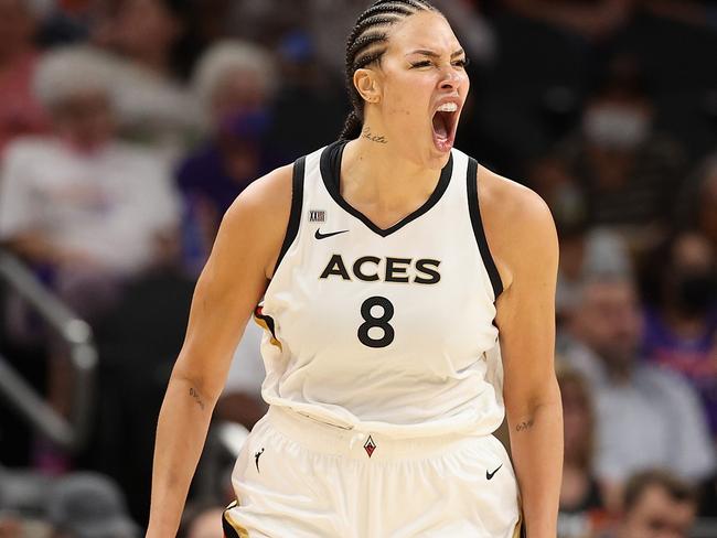 PHOENIX, ARIZONA - OCTOBER 06: Liz Cambage #8 of the Las Vegas Aces celebrates after a three-point shot against the Phoenix Mercury during the second half in Game Four of the 2021 WNBA semifinals at Footprint Center on October 06, 2021 in Phoenix, Arizona. The Aces defeated the Mercury 93-76. NOTE TO USER: User expressly acknowledges and agrees that, by downloading and or using this photograph, User is consenting to the terms and conditions of the Getty Images License Agreement.   Christian Petersen/Getty Images/AFP == FOR NEWSPAPERS, INTERNET, TELCOS & TELEVISION USE ONLY ==