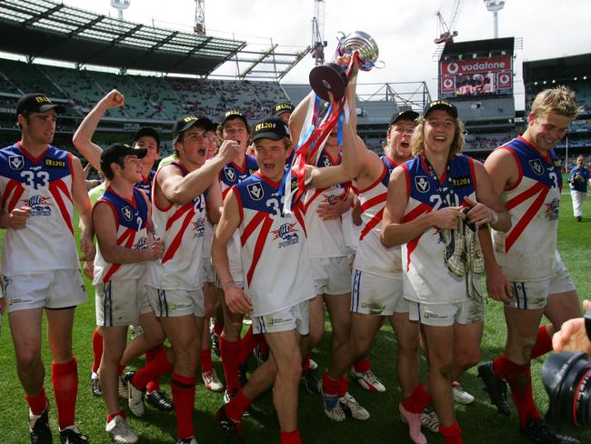 A young Beau Vernon holds the TAC Cup trophy aloft after Gippsland Power defeated Dandenong Stingrays in the 2005 grand final.