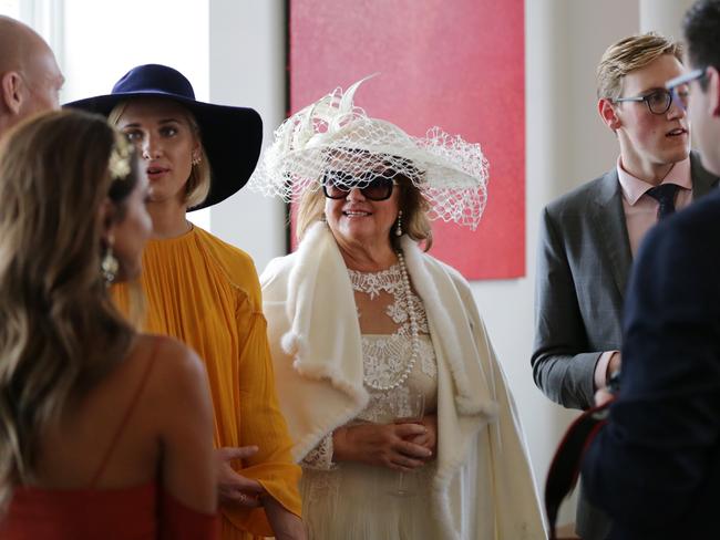 Gina Rinehart at the Melbourne Cup with Olympic gold medal-winning swimmer Mack Horton to the right. Picture: Christian Gilles