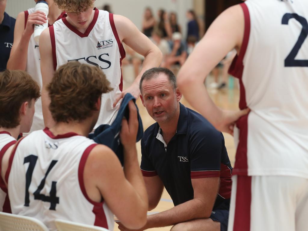 The Southport School coach Anthony Petrie lays down the law to his troops during the gold medal game. Picture Glenn Hampson