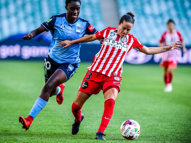Princess Ibini-Isei of Sydney competes for the ball against Lauren Barnes. Picture: AAP