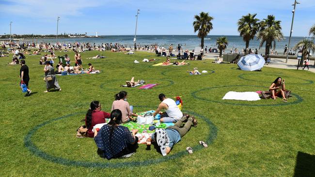 People enjoy the warm weather at St Kilda Beach on Melbourne Cup day. Picture: William West/AFP