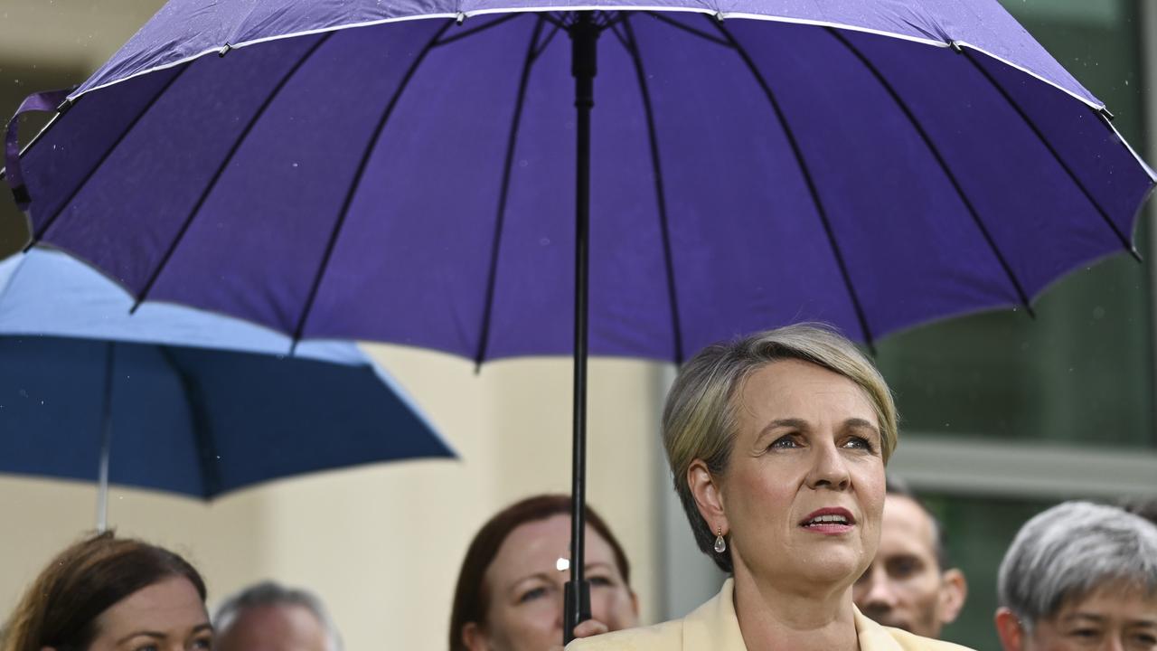 The rain was pouring down on the Labor celebrations. Picture: NCA NewsWire / Martin Ollman